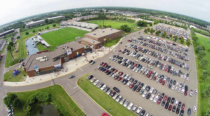 EMC photo from drone view of National Sports Center complex including ice arena, fields and parking lot